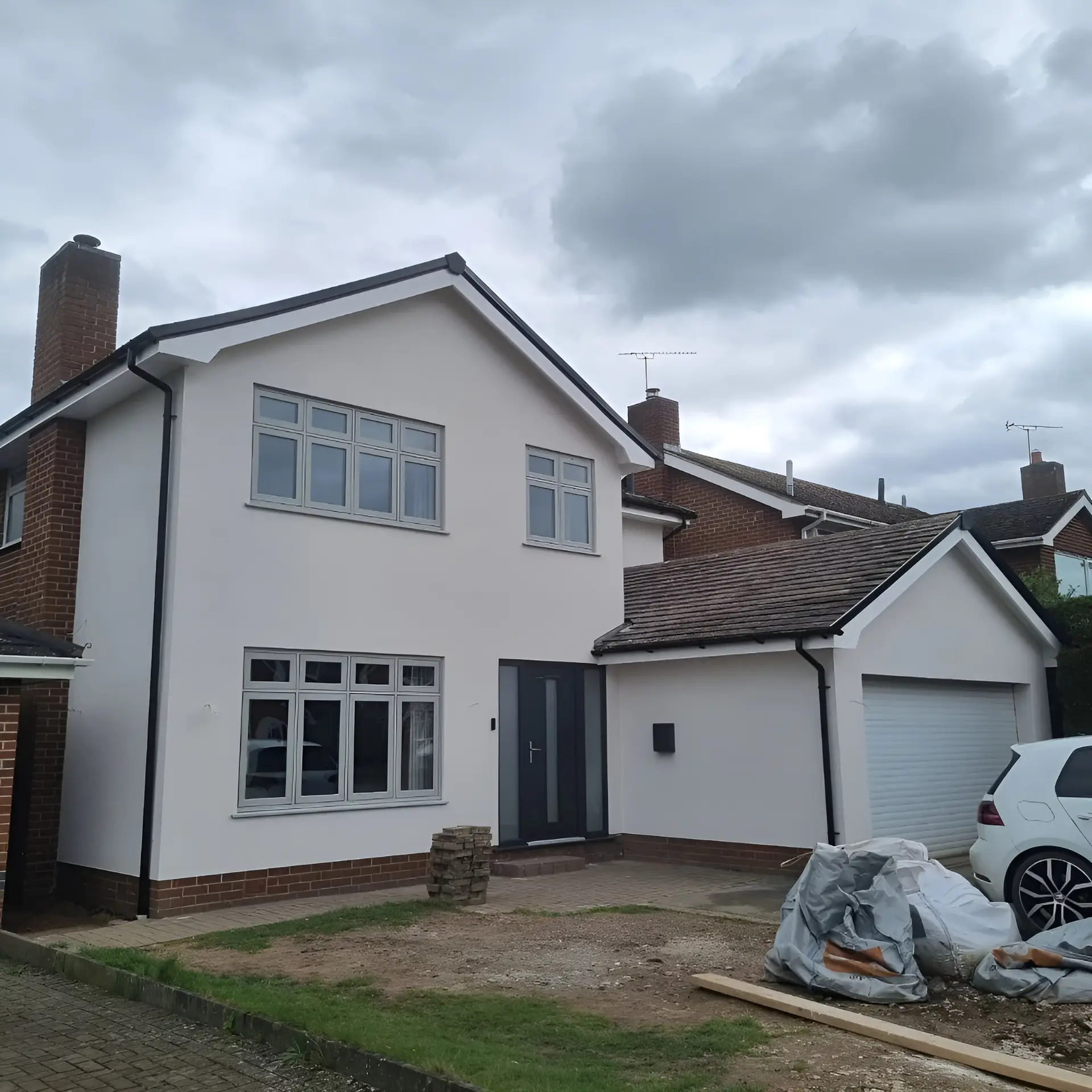 After picture of house with house rendering - London